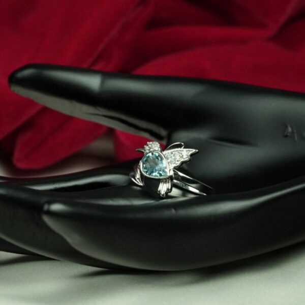 Bue Topaz Humming bird ring